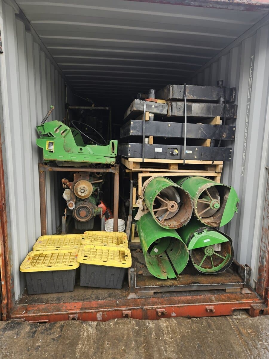 Interior of a shipping container packed with an engine, rotor drums and ballast weights